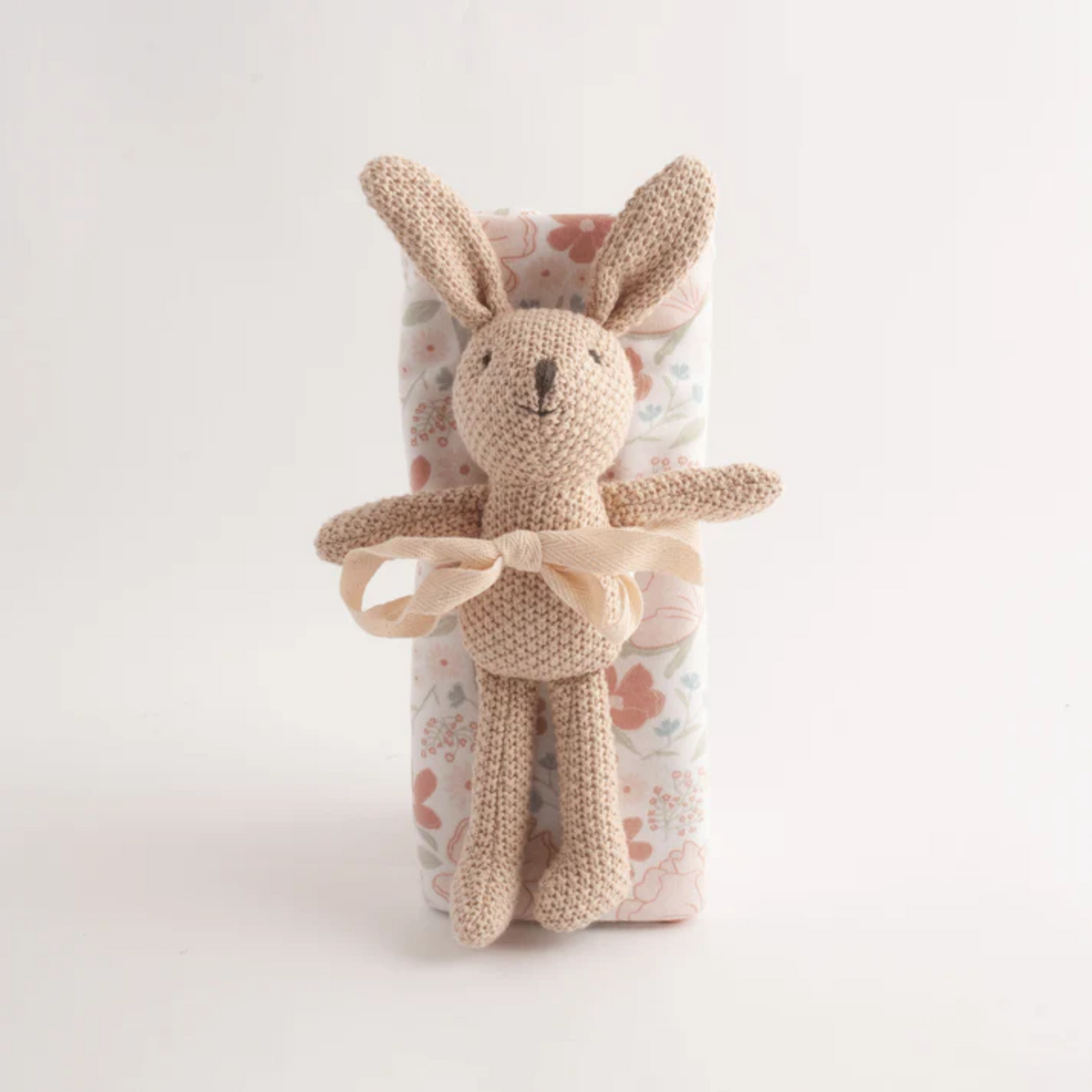Pink Floral muslin wrap with knitted bunny toy.